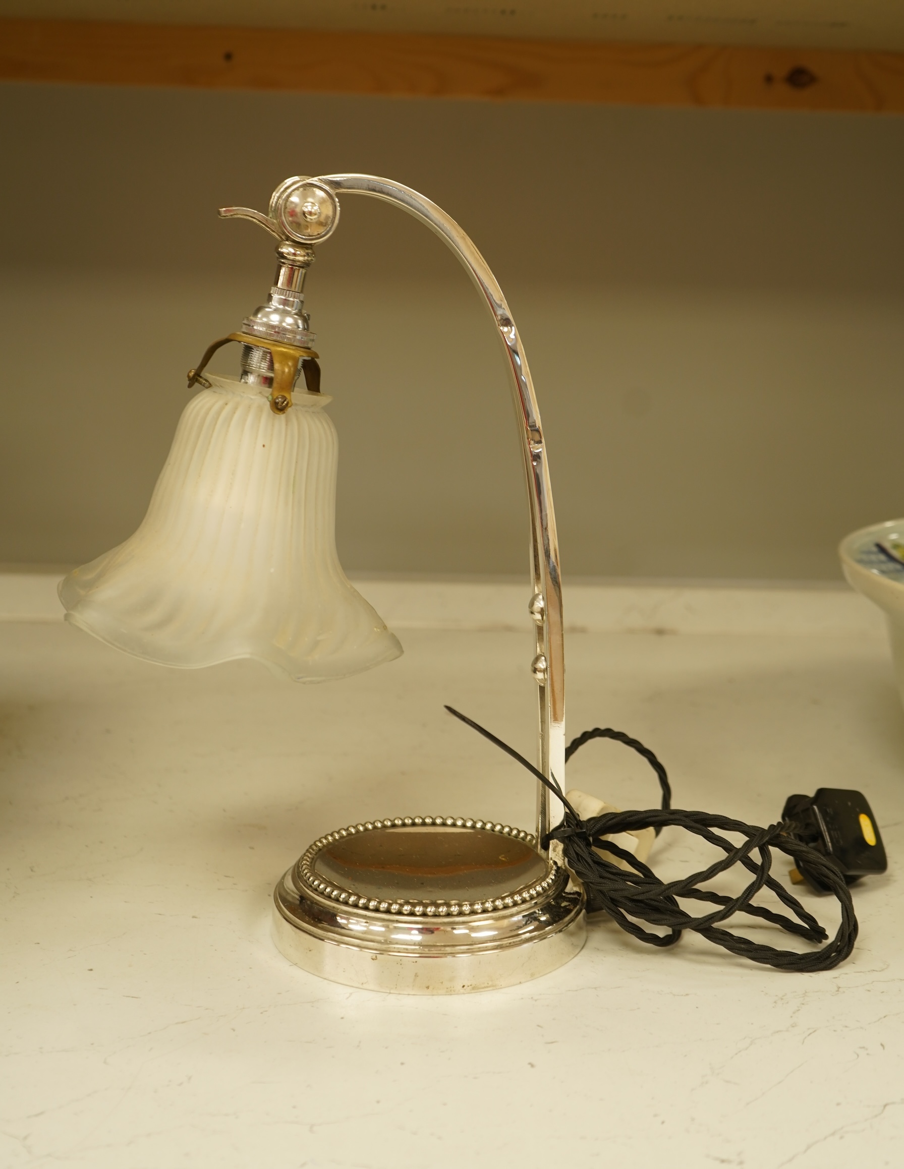 A plated adjustable desk light with opaque glass fluted shade, 35cm high